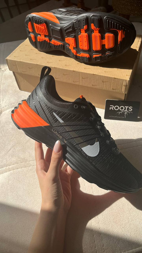 Nike lunar black and orange sneakers